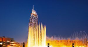 Tourist enjoying Dubai Fountain show .