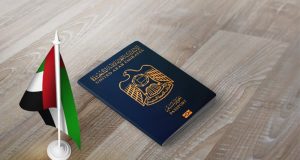 UAE passport besides UAE flag