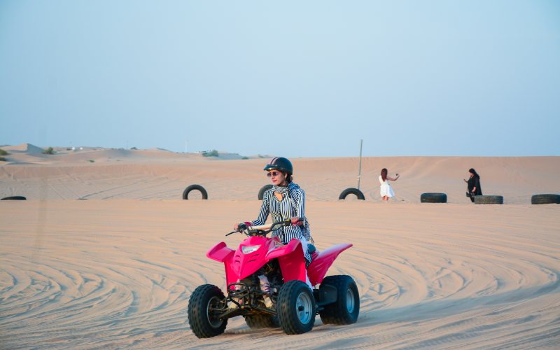 women enjoying dune buggy ride