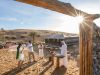Guests enjoying a traditional welcome at a luxury desert safari camp.