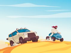 Man on quad bike and SUV driving over desert dunes.