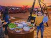 BBQ dinner in Dubai desert with a lady holding a baby