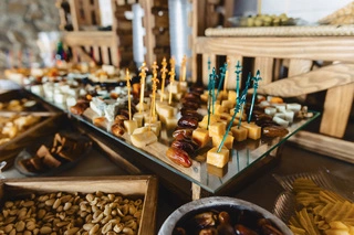Arabian-style buffet spread with nuts, dates, and cheese at Dubai desert safari