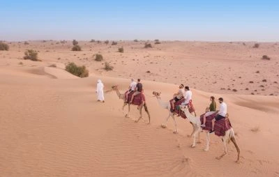 Camel Riding in Desert