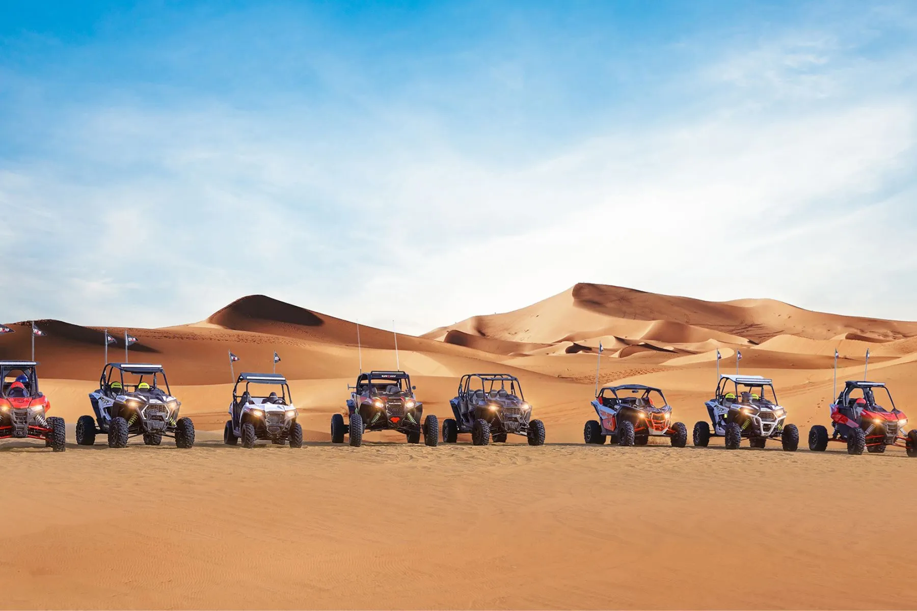 Dune buggy ride in Dubai with buggies lined up in the desert