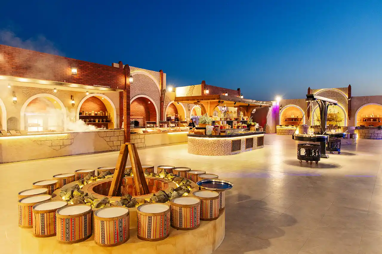 Evening desert safari in Dubai with beautifully arranged dinner setup under the stars