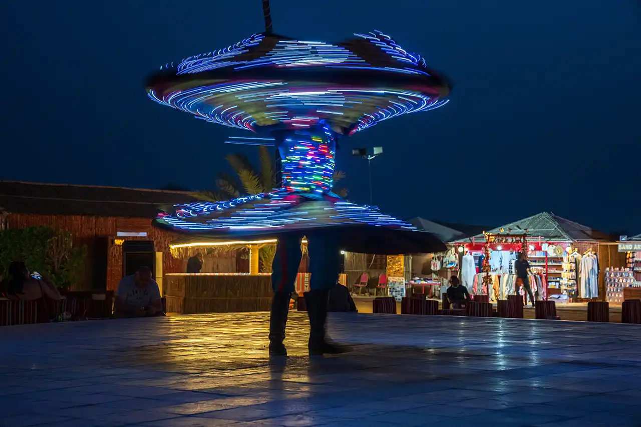 Colorful Tanoura dance show at a desert safari in Dubai