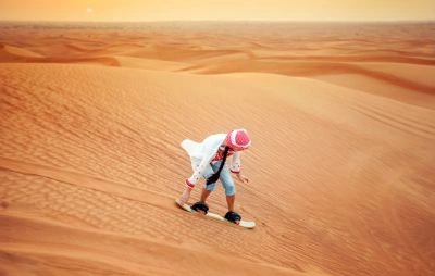 Sandboarding in Dubai Desert